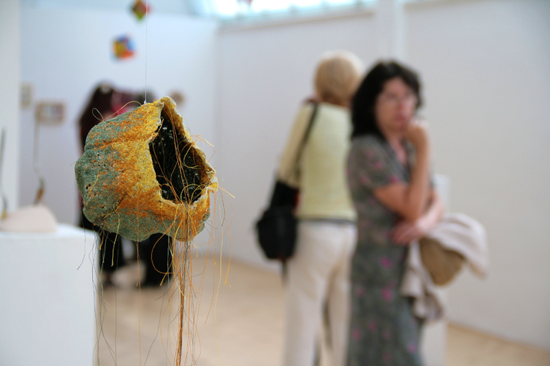 Visitors at the 16th Minitextile exhibition of the Slovak textile artists associationTxT