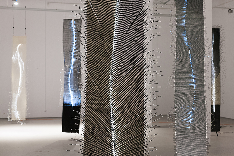 Włodzimierz Cygan, Poland : Tapping, series of woven works, 6 pieces, each 15 x 280 cm; fiber optic has been used in each one in a different way